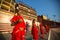 Young hindu monks conduct a ceremony to meet the dawn on the banks of the Ganges, and raise the Indian flag.