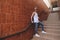 Young hipster man posing standing on the stairs