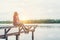 Young hipster woman sitting on pier,relaxing with natural freedom,enjoy and happy.