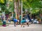 Young Hispanic Adults Wearing Face Masks Exercise Outdoor by Trees and Plants in Public Park