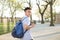 Young Hispanic boy with packpack walk on college campus