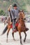 Young Hispanic Cowboy Throwing A Lasso