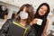 Young Hispanic Girl Student with Mother At Home Getting Ready For School Wearing Medical Face Mask