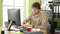 Young hispanic man business worker tired working drinking coffee at office