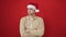 Young hispanic man standing upset wearing christmas hat over isolated red background