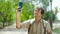 Young hispanic man tourist make selfie by smartphone smiling at park