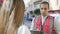 Young hispanic man volunteer speaking with person at street