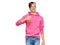 Young hispanic man wearing casual pink sweatshirt doing happy thumbs up gesture with hand