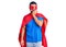 Young hispanic man wearing super hero costume looking stressed and nervous with hands on mouth biting nails