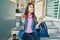 Young hispanic student girl smiling happy holding donut and green apple at the university