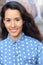 Young hispanic woman with cute freckles and a beautiful smile