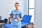 Young hispanic woman physiotherapist holding xray at rehab clinic