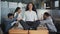 Young hispanic woman sitting on table in lotus position female leader meditating in office businesswoman feels calmness