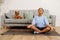 Young hispanic woman smiling and meditating during yoga practice