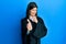 Young hispanic woman wearing judge uniform pointing fingers to camera with happy and funny face