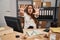 Young hispanic woman working at small business ecommerce doing stop gesture with hands palms, angry and frustration expression