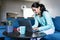 Young hispanic woman working or studying in a video call online with laptop at home in a home office concept in Mexico Latin Ameri