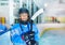 Young hockey player in protective equipment