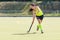 Young hockey player woman with ball in attack