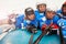 Young hockey players with sticks laying on ice