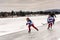 Young Hockey Skiers Skating on Mirror Lake