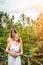 Young honeymoon couple posing on the bridge deep in the jungle. Rainforest of Bali island. Romantic shoot. Indonesia.