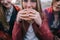 Young hot-eyed girl eats burger, close up
