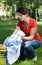 Young housekeeper with laundry outdoors