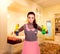 Young housemaid woman in uniform and rubber gloves