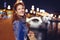 Young hungarian woman smiling on Margaret Bridge at night Budapest