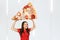 Young hunger pretty funny woman holds huge and large piece of pizza with cheese, Girl walks with big heavy pizza