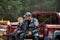 Young hunter boy sit with his father in a truck tailgate