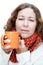 Young illness woman drinks tea with wrapping scarf on neck