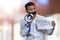 Young indian businessman with sealed mouth holding poster with inscription Free speech.