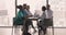 Young Indian doctor woman meeting with multiethnic colleagues at table