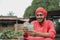 Young indian farmer counting money