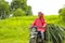 Young indian farmer transport cattle food on two wheeler