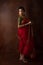 Young Indian female wearing Maharashtrian style red saree