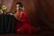 Young Indian female wearing Maharashtrian style red saree