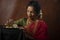 Young Indian female wearing Maharashtrian style red saree