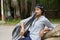 Young Indian girl with short hair wearing headgear and posing for camera, Pune