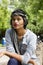 Young Indian girl with short hair wearing headgear and posing for camera, Pune