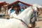 Young indian gypsy nomad with white horse at Pushkar camel fair,India