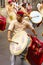 Young Indian man, dressed traditionally playing dhol-taasha during Ganapti Visarjan