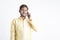 Young indian man in tradition wear and talking on smartphone