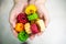 Young indian woman holding colorful fried food made of potato starch and sago called far far fryums which is a popular