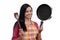 Young Indian woman holding kitchen utensil