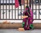 A young Indian woman sitting by the roadside