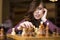 Young intelligent caucasian woman playing chess at home wearing smart casual clothes