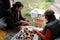 Young intercultural male and female mushroom pickers sorting fungi